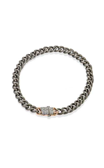 A mixed metal diamond chain bracelet on a white background