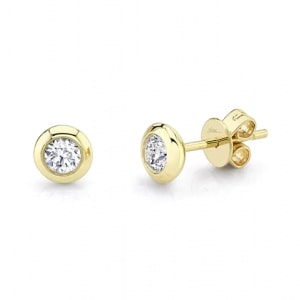a 14k yellow gold bezel-set diamond stud earrings.