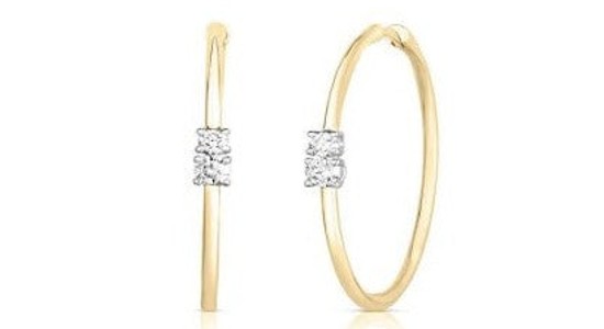 a pair of yellow gold hoop earrings featuring diamond accents