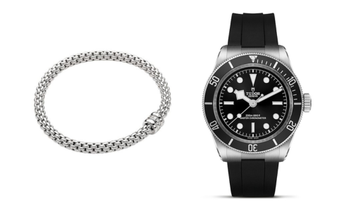 A white gold Fope chain bracelet alongside a complimentary TUDOR Black Bay watch, both available at Exclusively Diamonds.